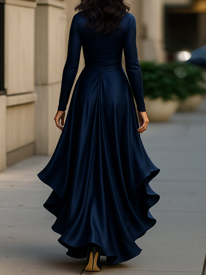 Flowing ruffle hem of a women's formal pleated maxi dress, designed for elegance at any special occasion.