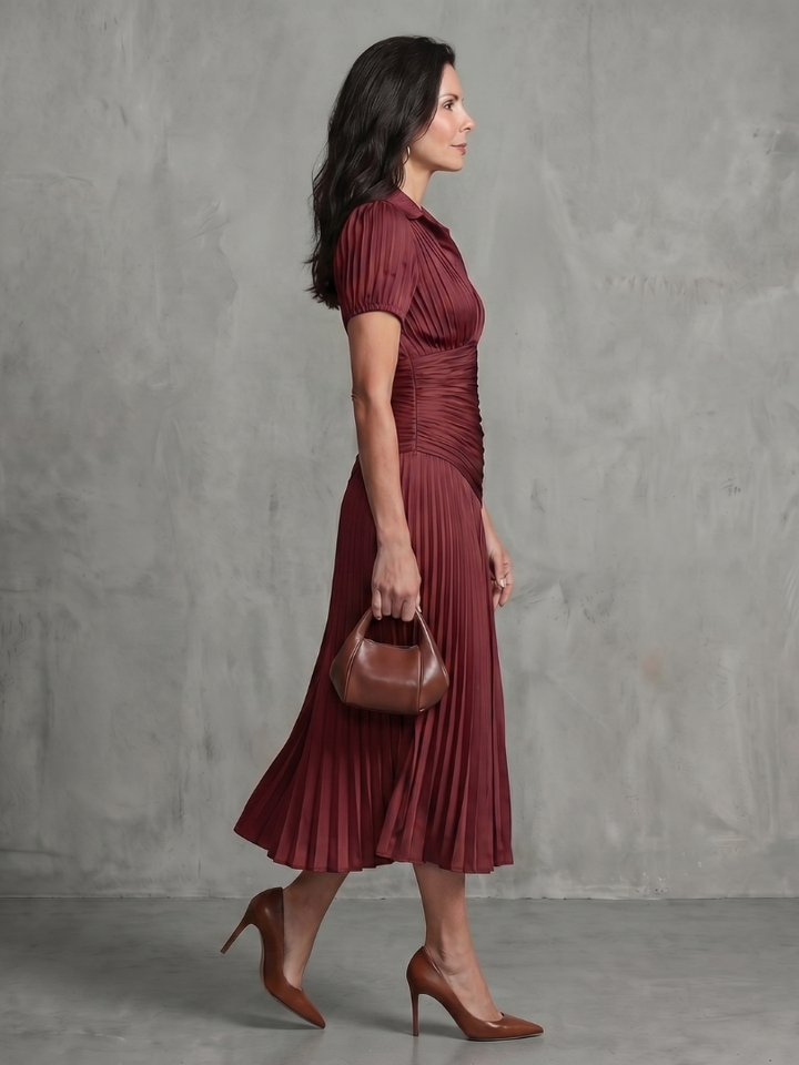 Chic women's pleated collared midi dress, striped for a modern look. Comfortable short sleeve design.