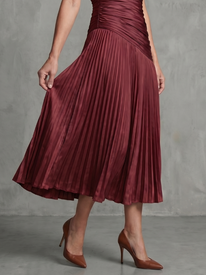 Women's elegant collared midi dress with a fresh stripe pattern and graceful pleats. Short sleeves.