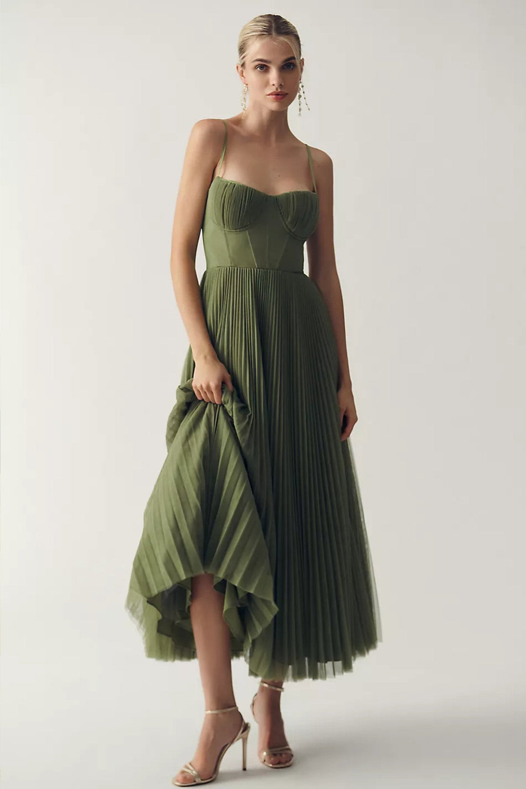 Women's pleated tulle midi slip dress with corset bodice & spaghetti straps. Ideal for wedding guests.