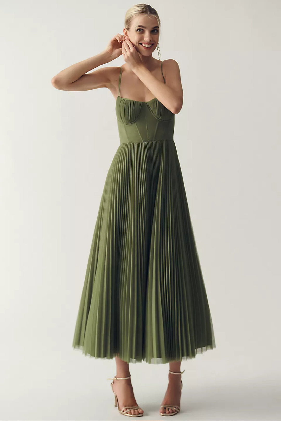Elegant women's pleated tulle midi dress with corset bodice & spaghetti straps. Perfect wedding guest or evening dress.