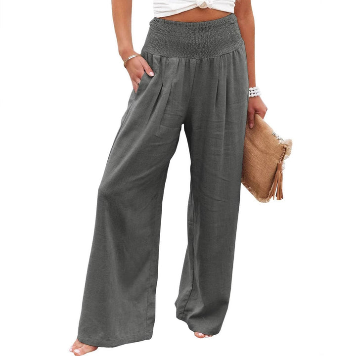 Full-length view of women's wide leg pleated pants with elastic waist for a stylish summer outfit.