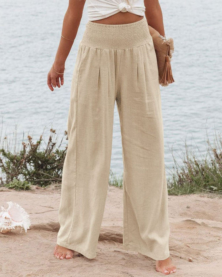 Casual women's wide leg pleated trousers. Elastic waistband ensures a comfortable, relaxed fit.