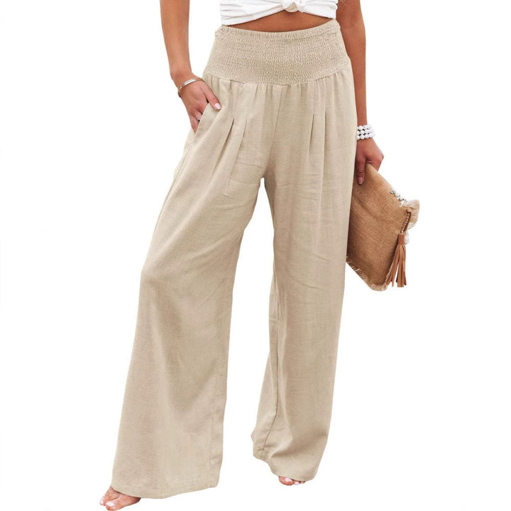 Chic women's pleated wide leg pants. Fashionable elastic waist trousers, ideal for summer comfort.