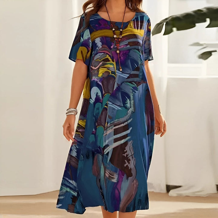 Women's plus size abstract print midi dress, relaxed fit with short sleeves. Comfortable & stylish casual wear.