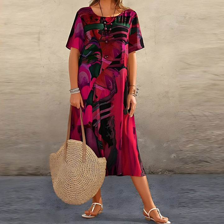 Bohemian style women's plus size abstract print midi dress. Relaxed fit, short sleeve, versatile casual summer outfit.