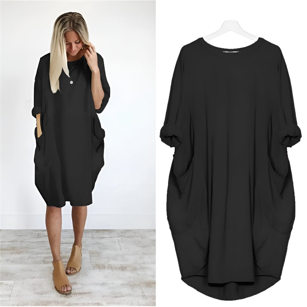 Women's plus size black midi dress with batwing sleeves, comfortable and stylish for everyday wear.