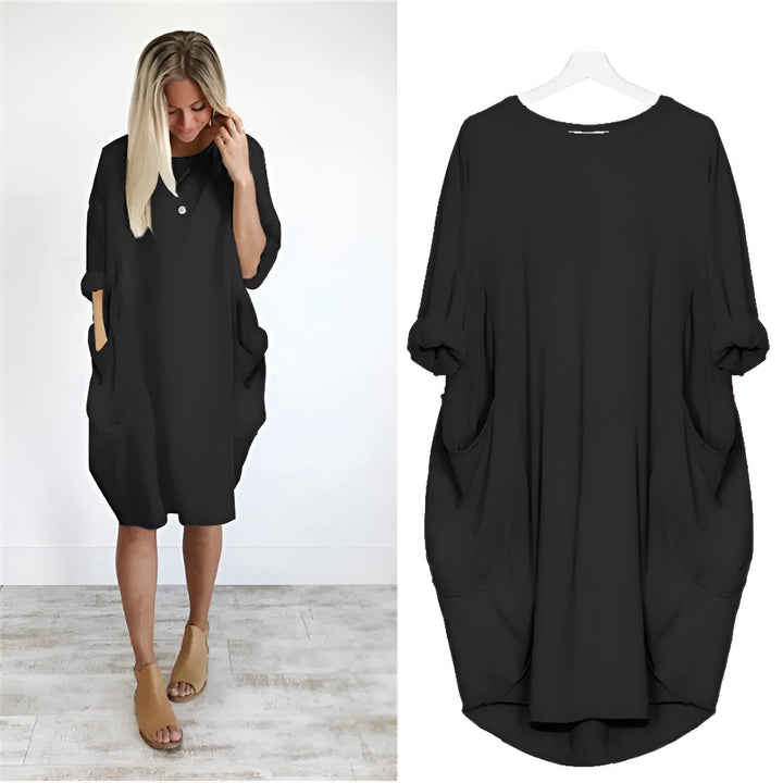 Women's plus size black midi dress with batwing sleeves, comfortable and stylish for everyday wear.