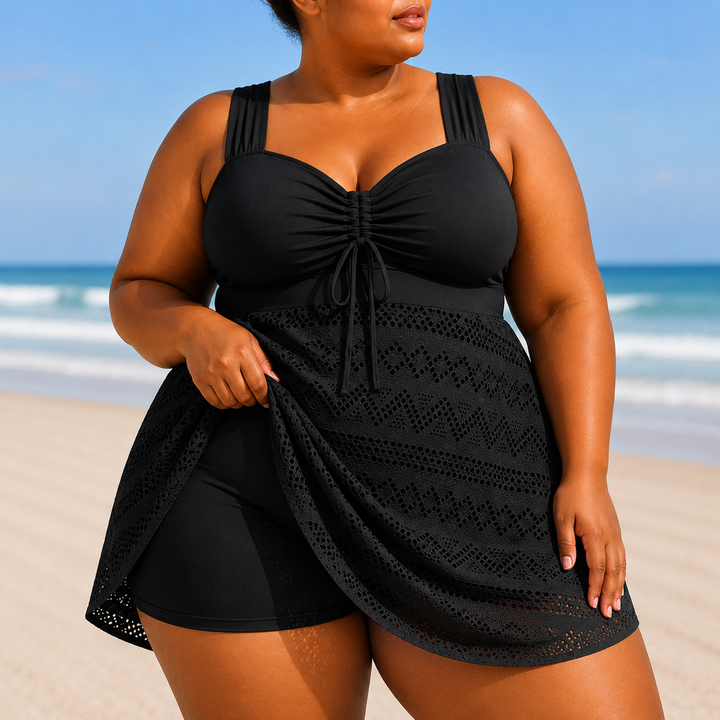 Women's plus size elegant black beach swim dress, modest swimwear perfect for resort wear or vacation.