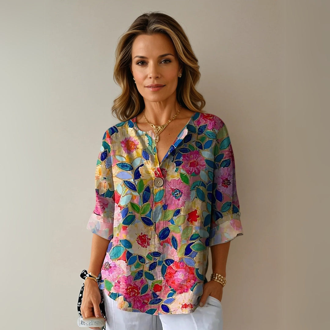 Women's plus size floral print blouse with V-neck & button-up front. Elegant & casual spring/summer top.