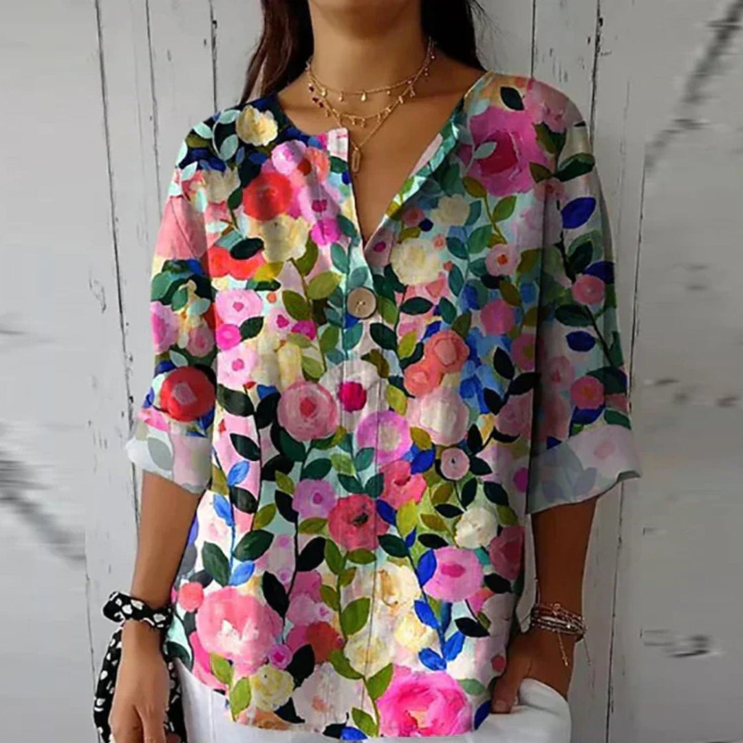 Women's plus size floral print long sleeve blouse, V-neck, button-up. Elegant spring/summer style.