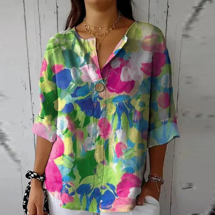 Plus size women's floral print V-neck button-up blouse. Versatile for casual or elegant spring looks.