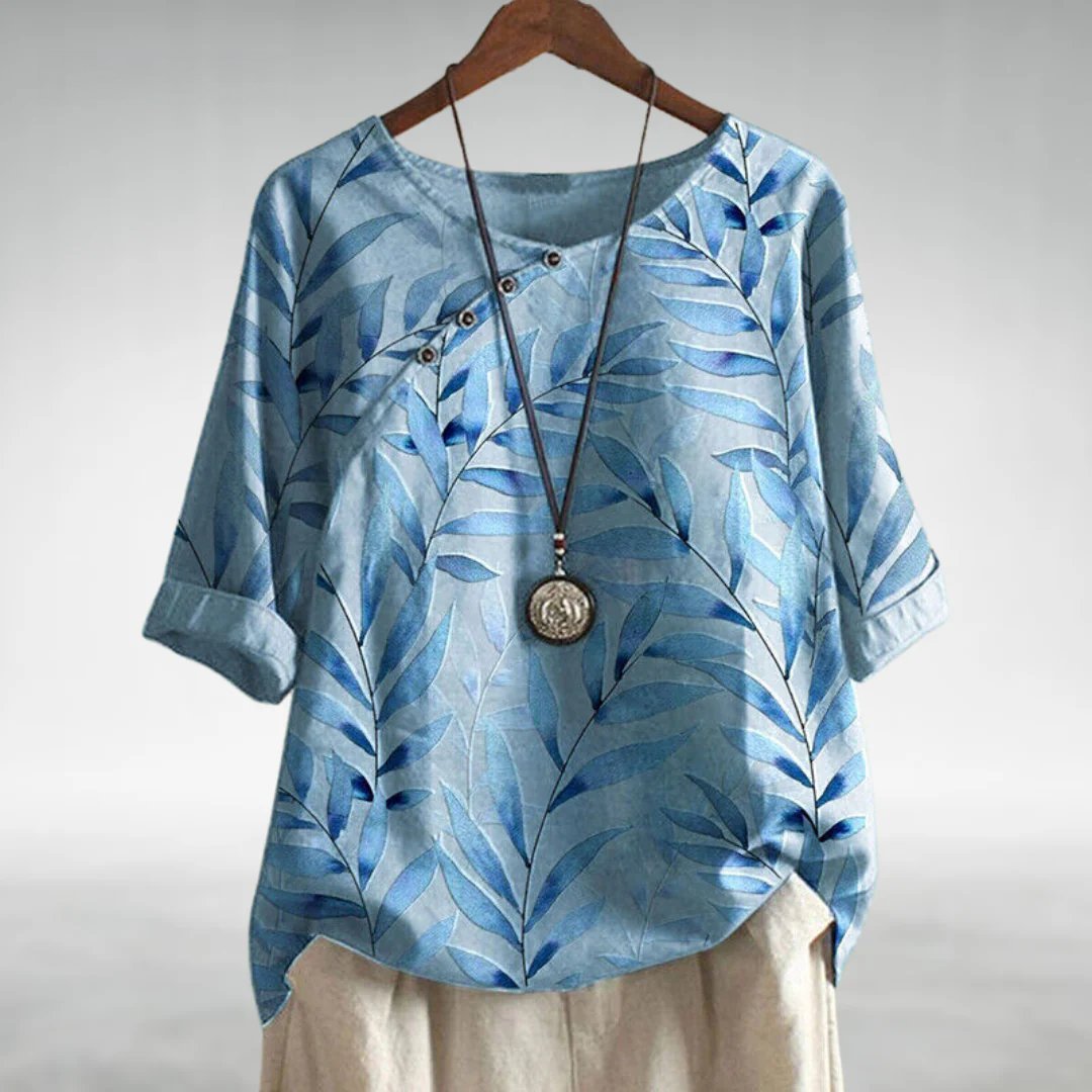 Women's plus size leaf print blouse with relaxed fit & button front closure, ideal for comfortable casual wear.