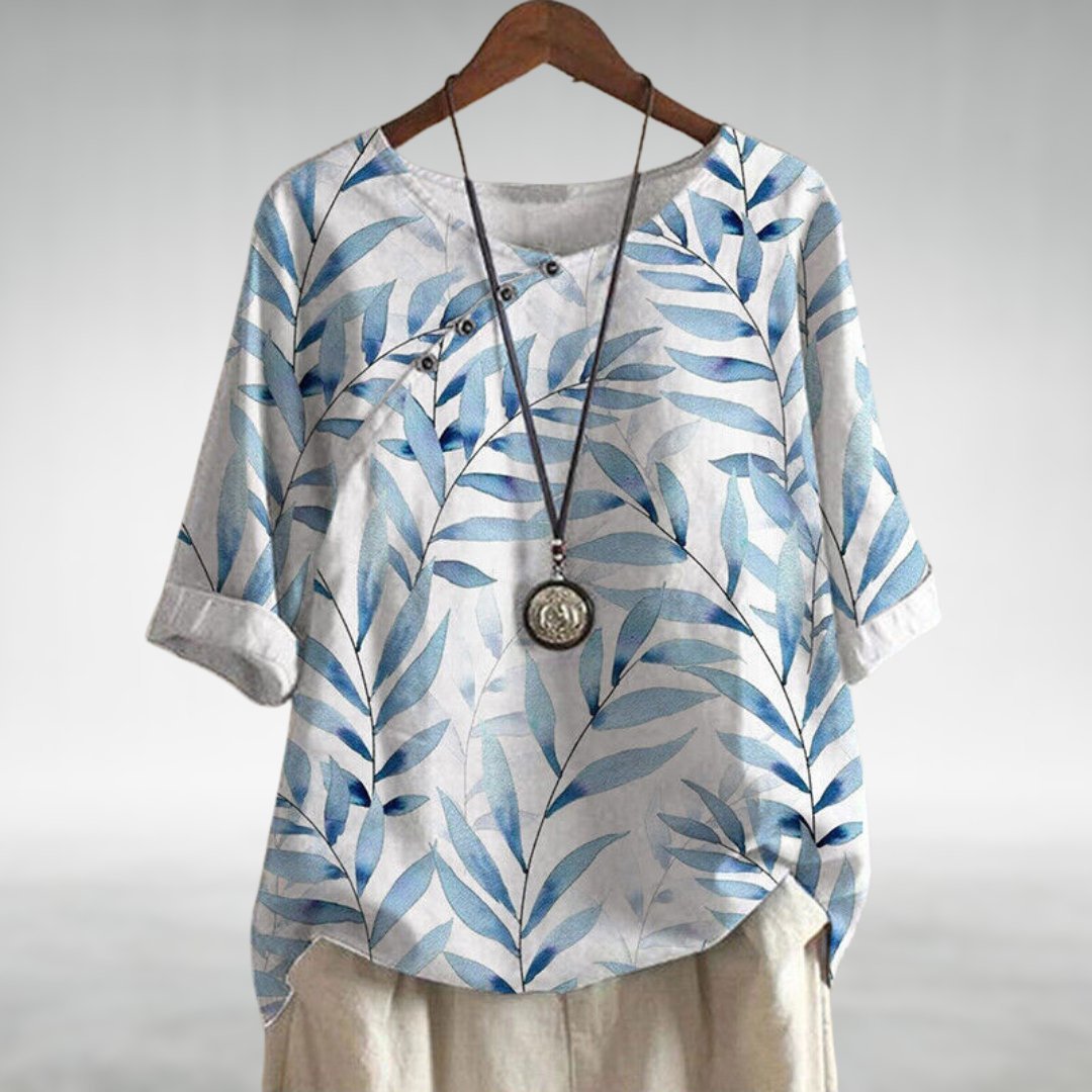 Comfortable plus size women's blouse with a fashionable leaf print & relaxed fit, perfect for versatile styling.