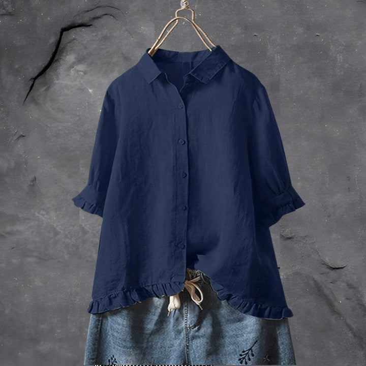 Elegant plus size short sleeve women's blouse, ruffled hem & classic collar. Versatile for casual or professional.