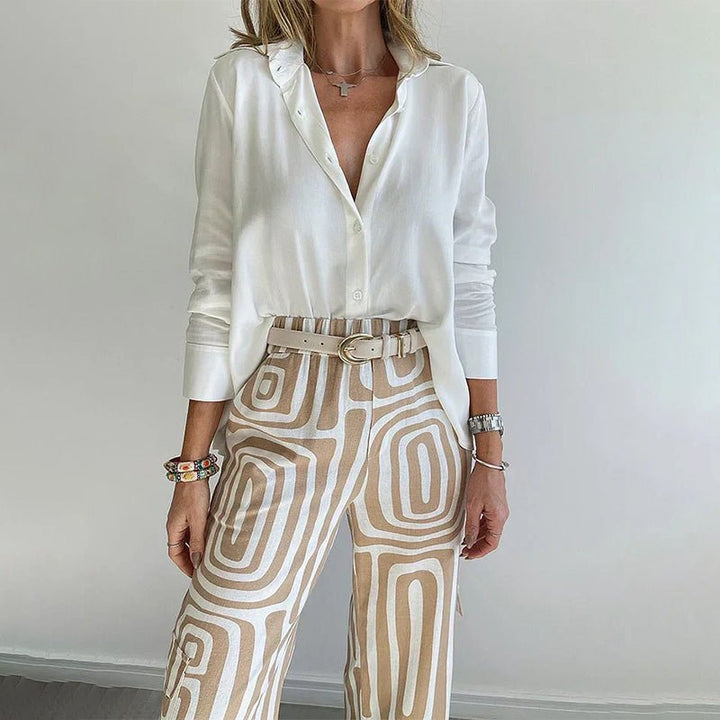 Comfortable plus size two-piece set for women: stylish button-up top & trendy patterned trousers. Perfect for work.