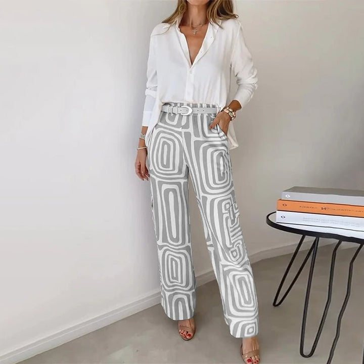 Women's plus size smart casual two-piece set with a sophisticated button-up shirt & chic patterned trousers.