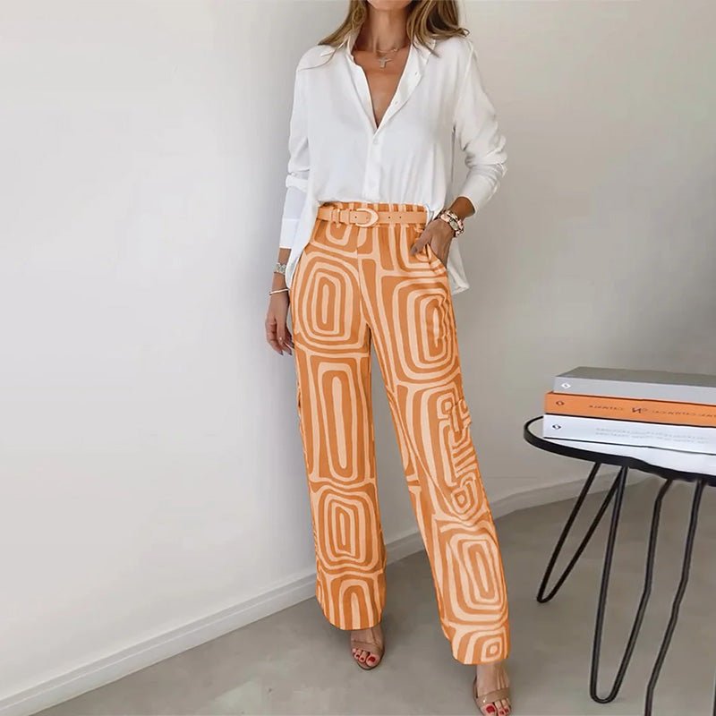 Fashionable plus size women's two-piece outfit: button-up shirt and matching geometric patterned pants set.