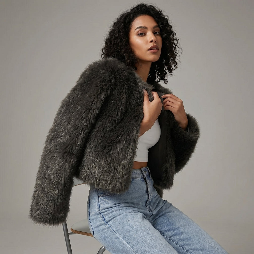 Luxurious women's faux fur cropped jacket, offering plush warmth & elegant winter style.