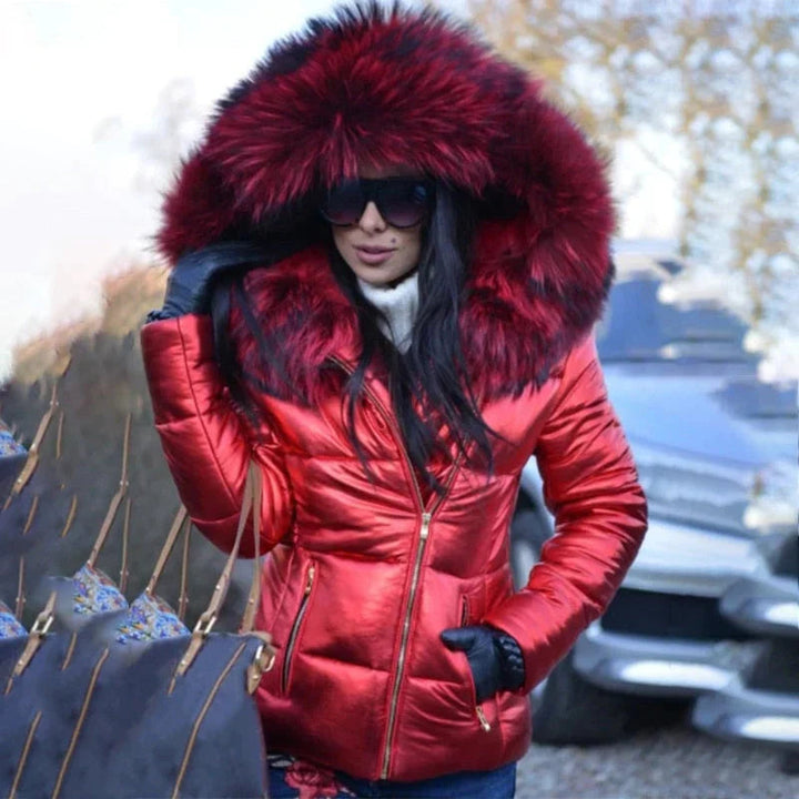 Warm women's winter puffer jacket with plush faux fur hood, ideal for outdoor cold.