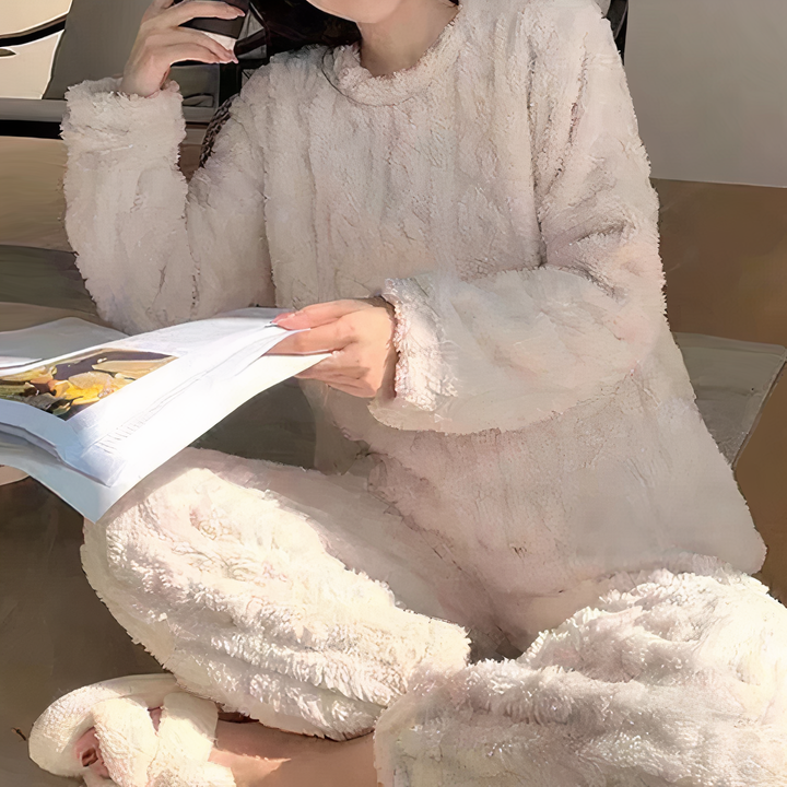 Comfortable women's plush fleece pajama set. Essential warm sleepwear for cozy winter evenings.