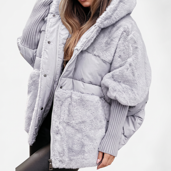 Elegant women's hooded plush coat. Ideal cozy and warm outerwear for winter fashion and comfort.