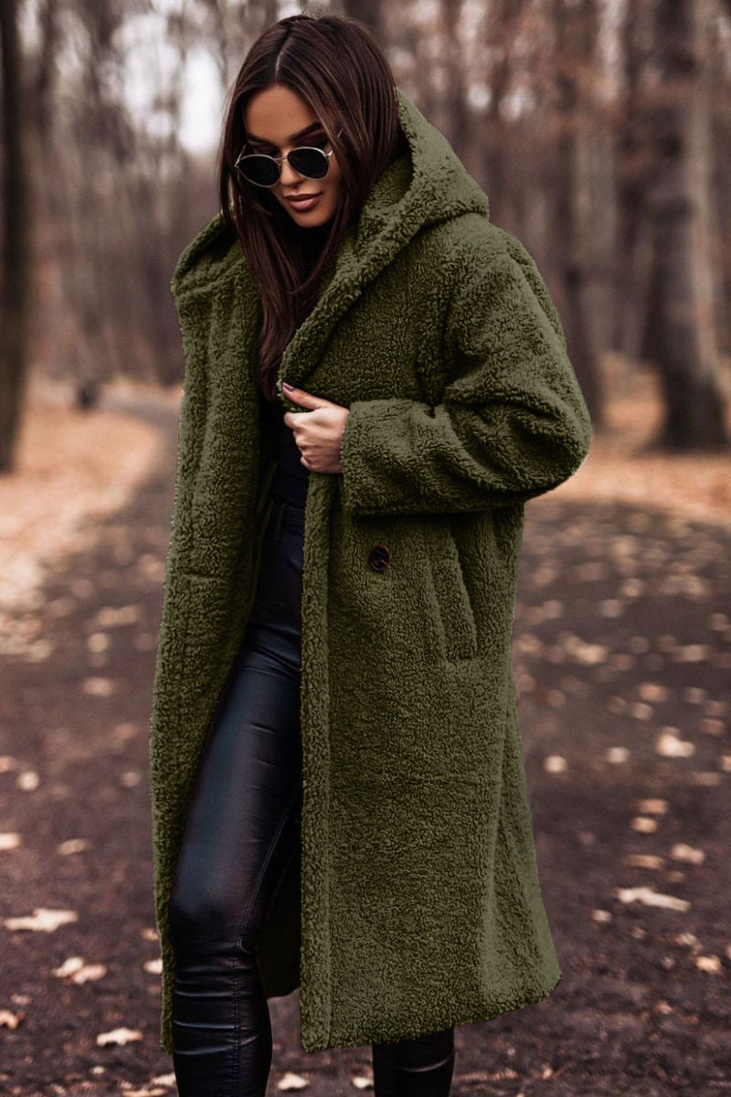 Elegant women's hooded teddy coat. Plush, cozy, and stylish outerwear for cold season fashion.