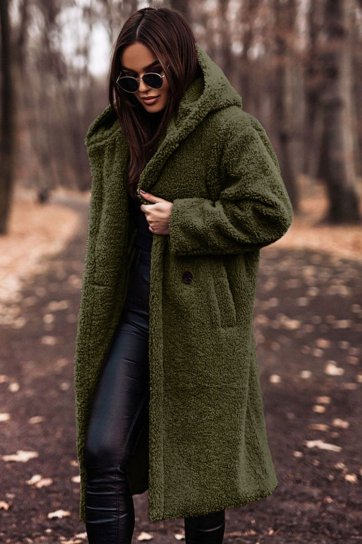 Elegant women's hooded teddy coat. Plush, cozy, and stylish outerwear for cold season fashion.
