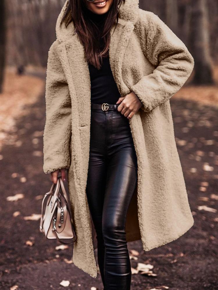 Women's plush long hooded winter coat in an oversized fit, perfect for cozy and warm fall fashion.