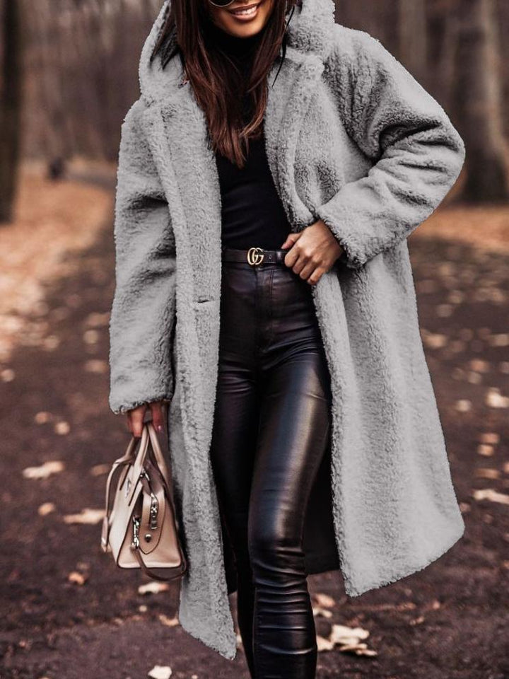 Warm hooded plush jacket for women, a stylish and cozy long coat suitable for casual winter fashion.