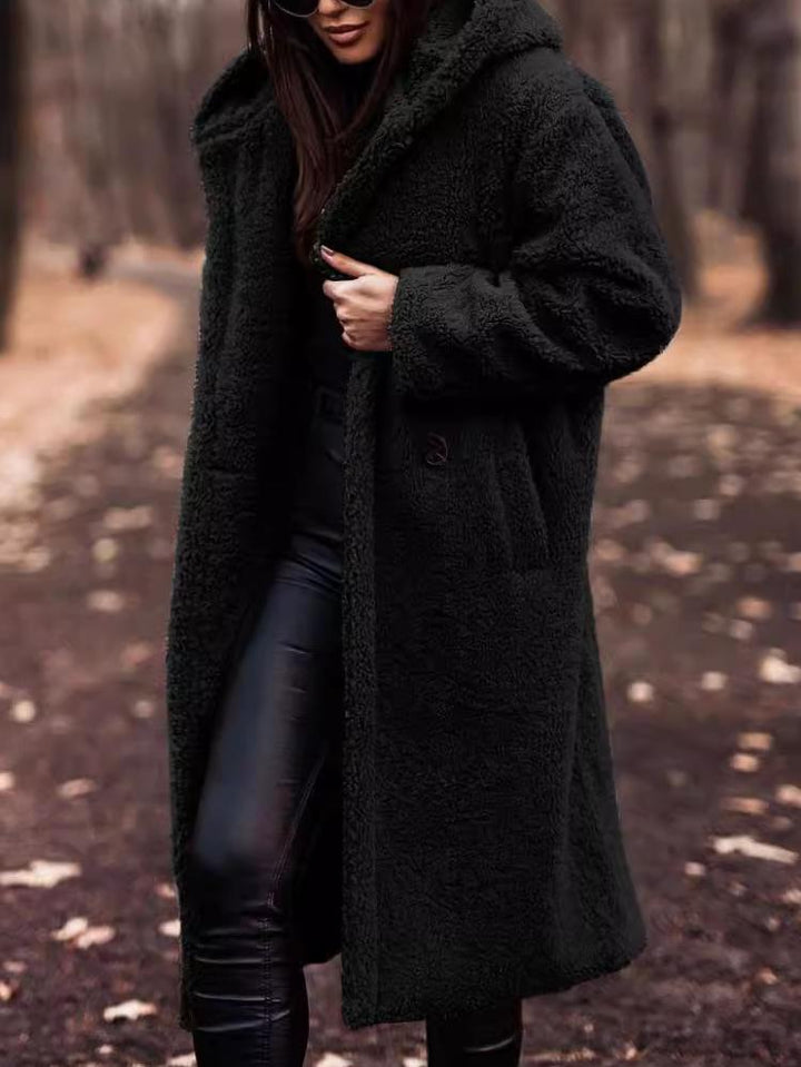 Soft women's plush hooded long coat, a must-have for winter fashion and cozy outerwear style.