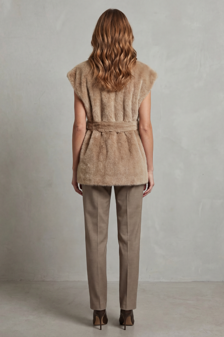 Chic women's brown plush longline vest featuring an adjustable belt, offering cozy and sophisticated style.
