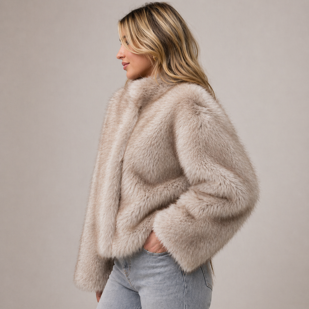 Chic women's elegant plush winter jacket. Relaxed fit outerwear provides cozy warmth for cold weather fashion.