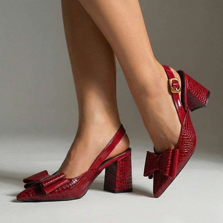 Women's pointed toe slingback heels with a block heel, elegant and comfortable dress shoes for any occasion.