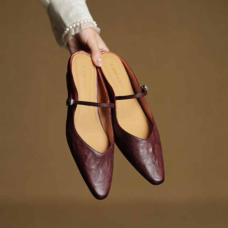 Sophisticated women's pointed toe flats, slip-on mules with a refined strap.