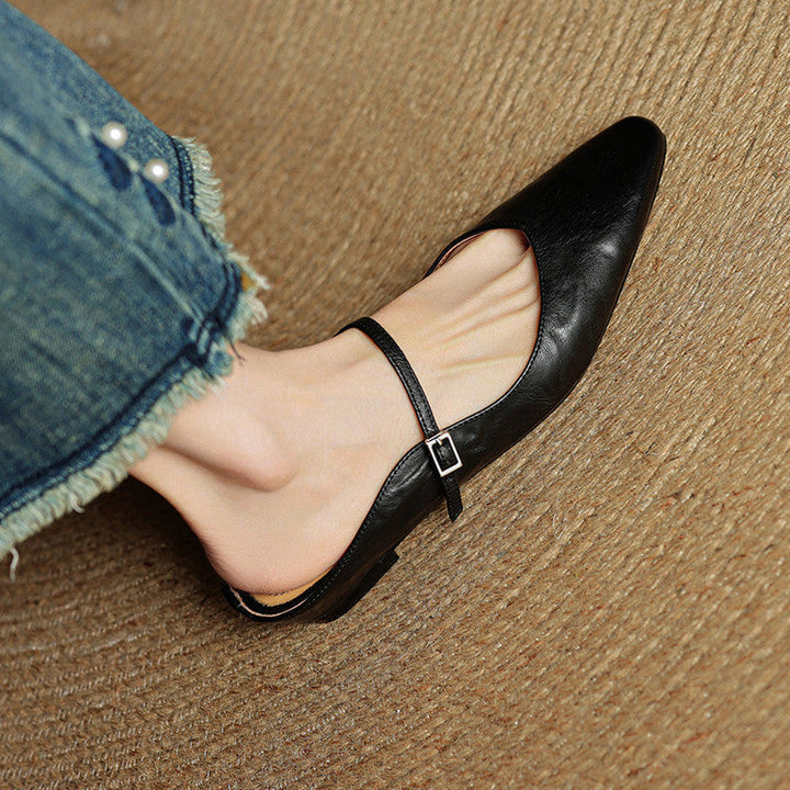Comfortable black women's pointed toe mules, easy slip-on, with a stylish strap.