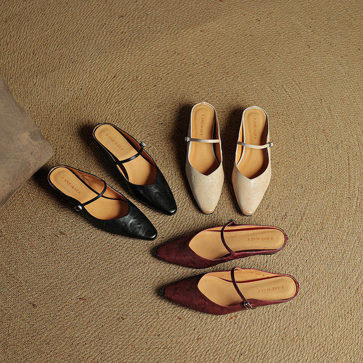 Chic black women's pointed toe slip-on mules, comfortable and stylish strap.