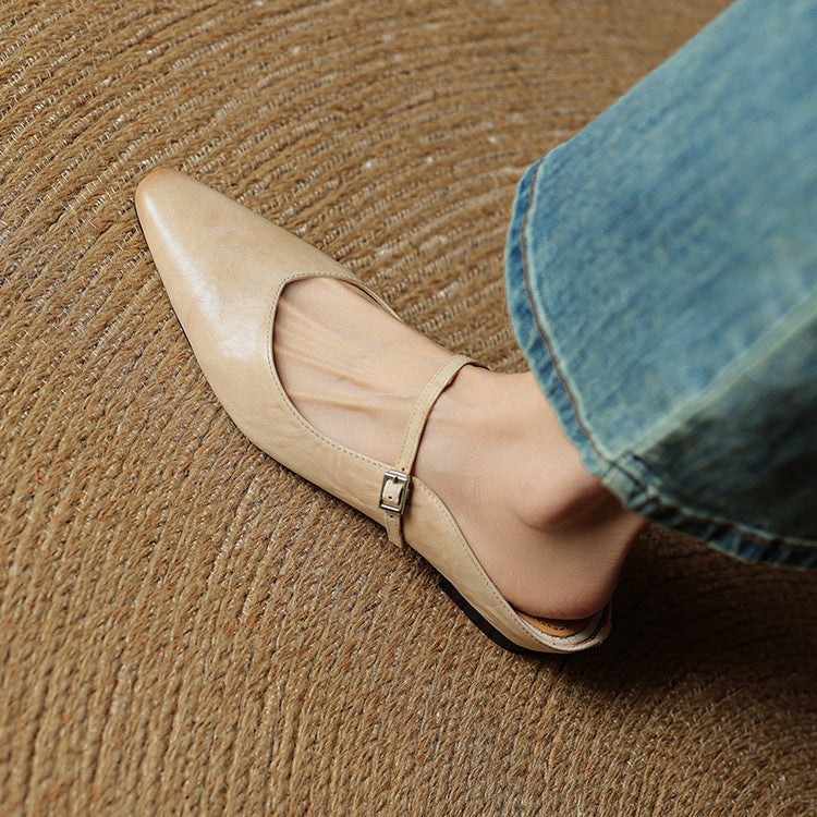 Casual yet sophisticated women's pointed toe slip-on mules, strap accent.
