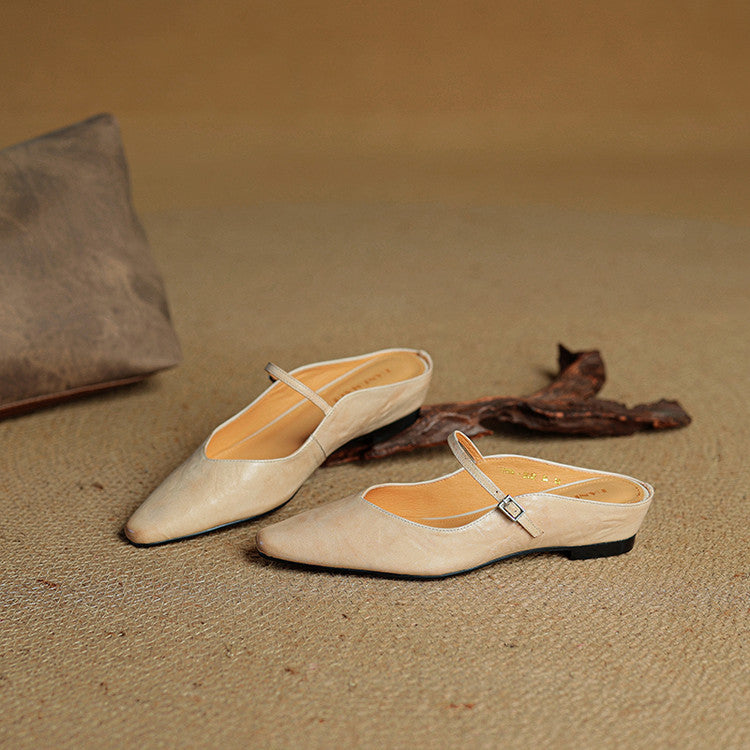 Versatile women's slip-on pointed toe mules, strap detail for day-to-night wear.