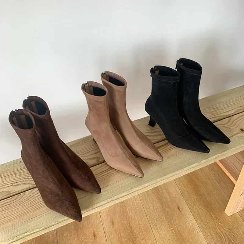 Versatile women's pointed toe sock boots. Elegant pull-on ankle boots with a comfortable kitten heel for any occasion.