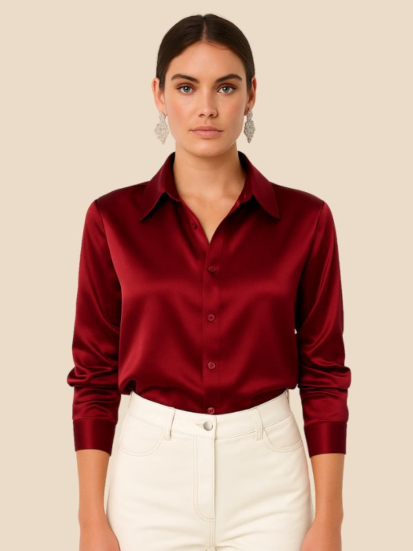 Women's polished button-down shirt with a classic pointed collar, perfect for office or casual wear.