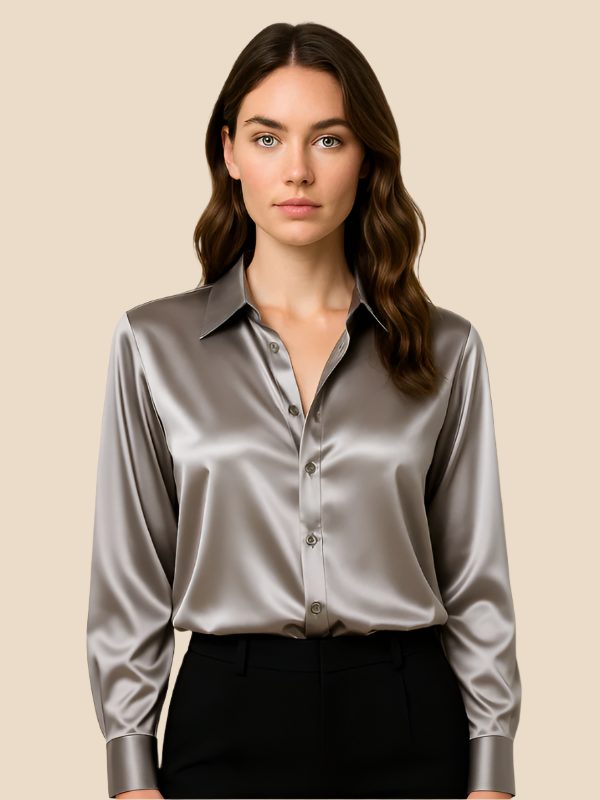 Classic women's button-down blouse, a polished long-sleeve top with a crisp pointed collar detail.