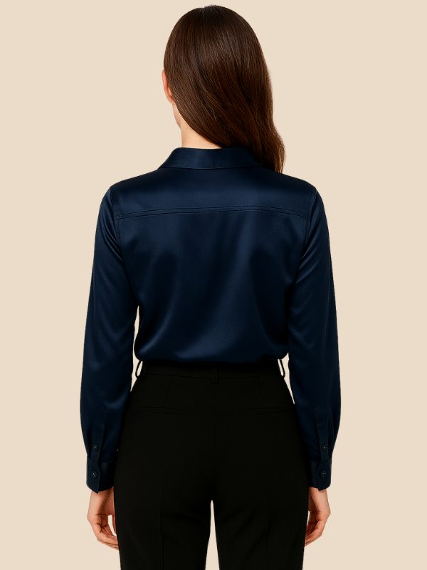 Sophisticated women's long-sleeve shirt, polished for office wear, featuring a pointed collar.
