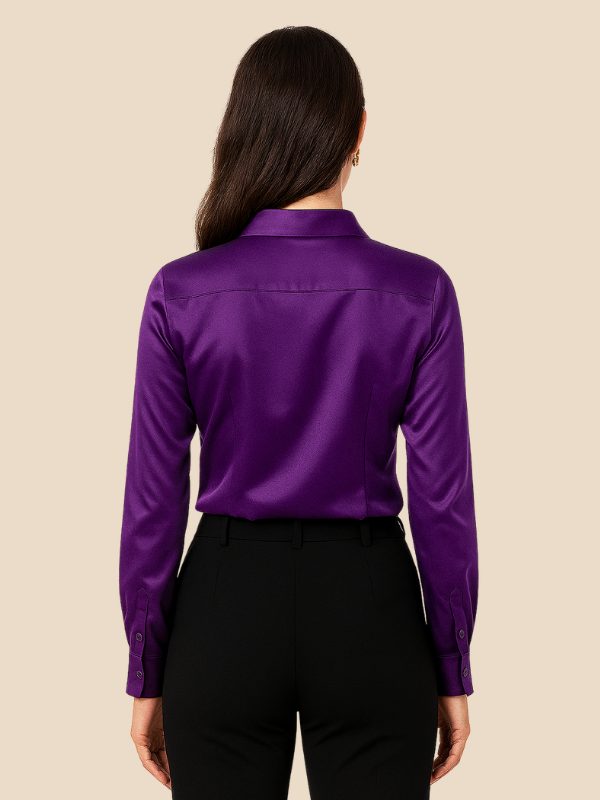 Classic women's button-down shirt, a polished long-sleeve top ideal for office wear and casual chic.