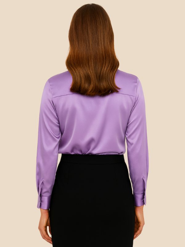 Versatile women's button-down shirt, a long-sleeve top with a classic pointed collar for any occasion.