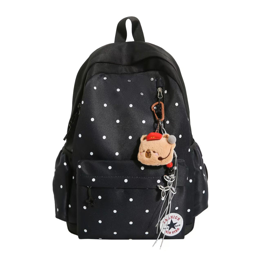 Chic women's polka dot accessory backpack with sparkling embellishments and a delightful charm.