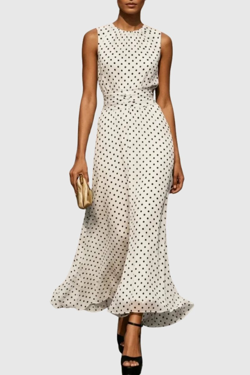 Women's polka dot sleeveless maxi evening gown with ruffle hem, perfect for elegant occasions.
