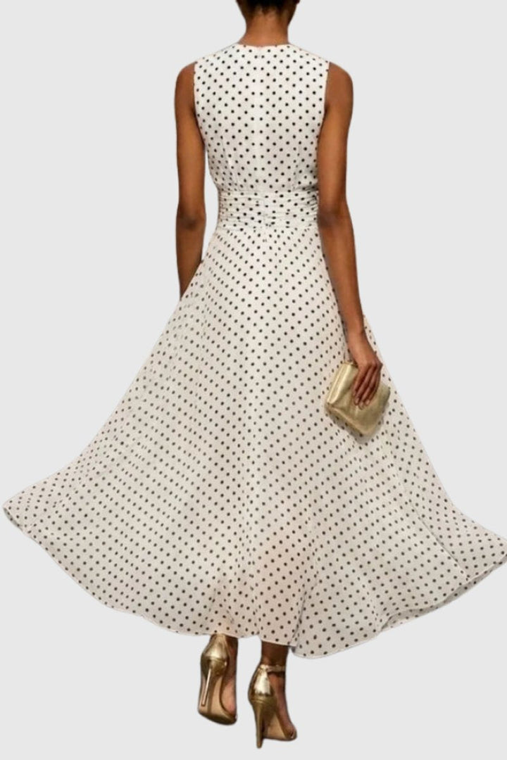 Elegant A-line polka dot sleeveless maxi dress for women, ideal as a wedding guest or party dress.