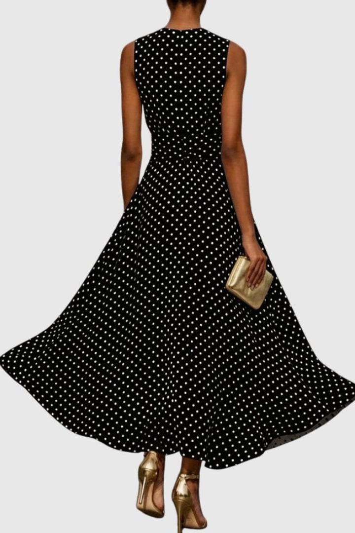 Chic women's polka dot maxi dress with ruffle hem, a versatile sleeveless gown for summer events.