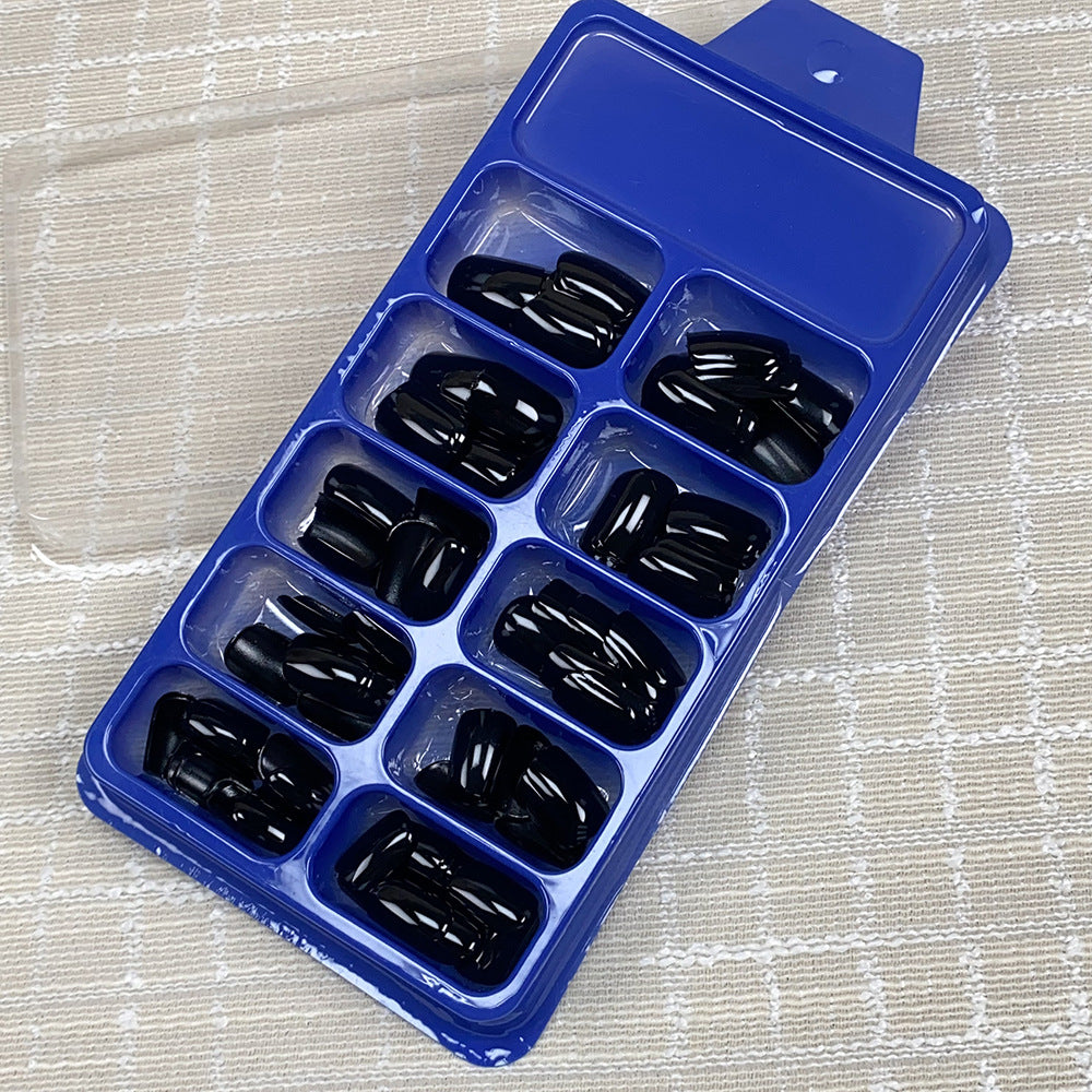 Women's premium black press-on nail set, long-lasting & reusable for a quick, stylish manicure.